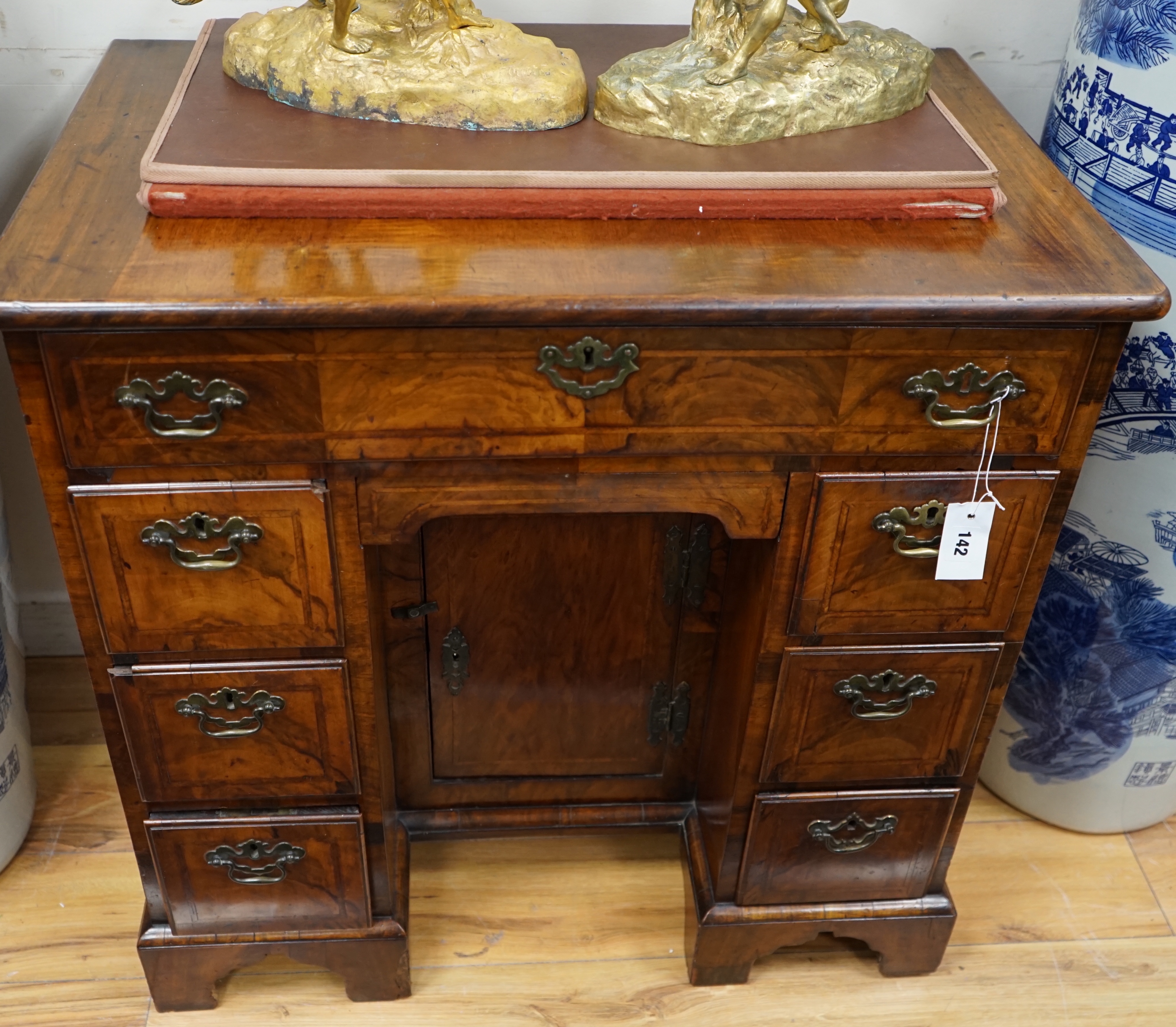 An 18th century and later walnut kneehole desk, width 78cm depth 50cm height 76cm